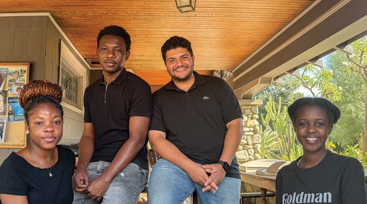The founds of the Pitzer Connect tech club pose on the porch of the Grove House