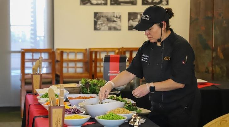 a staff member gives a food demonstration