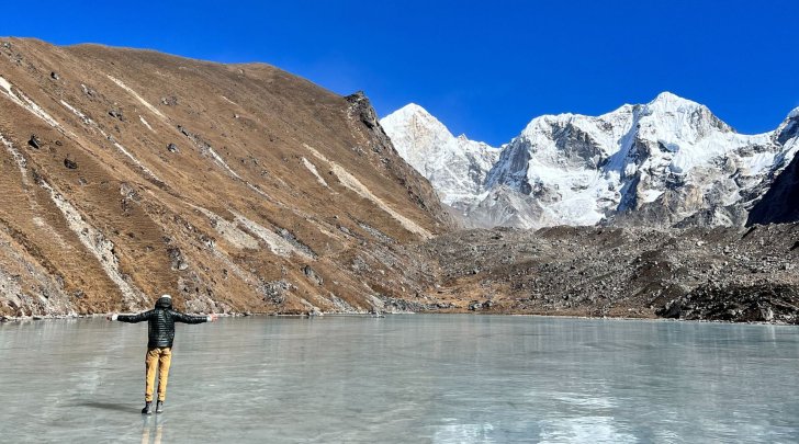 Student standing on glacier