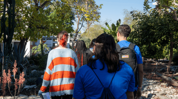 students on a campus tour lead by Pitzer students
