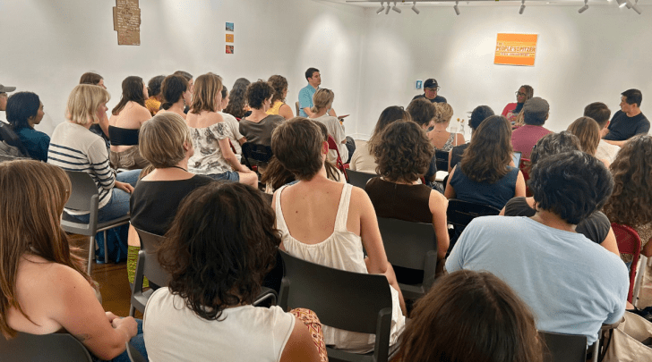 students at a faculty panel in the Lenzner Gallery