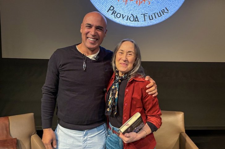 Peter Harper and Ellen Harper standing together on the Benson Auditorium stage and smiling.