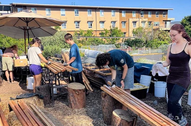 Pitzer students work in the student garden on Earth Day