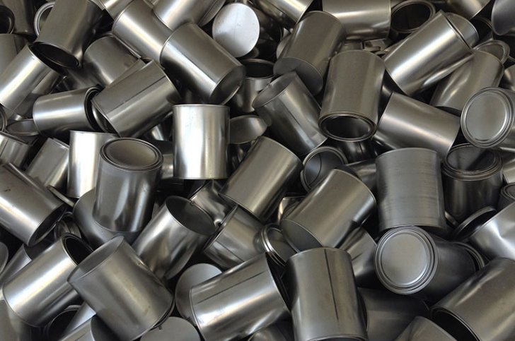 a pile of aluminum food cans