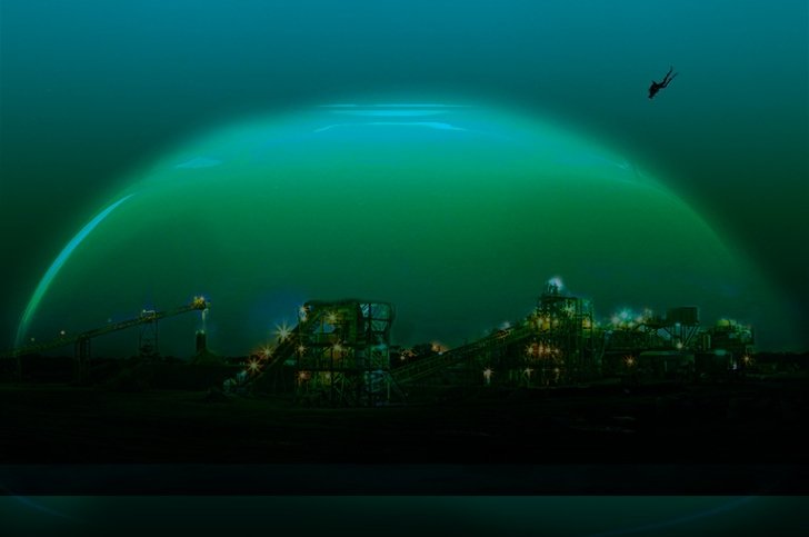 A diver swims toward an underwater factory