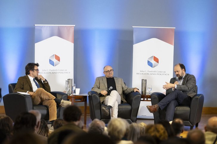 Phil Zuckerberg sits on a stage with two guests