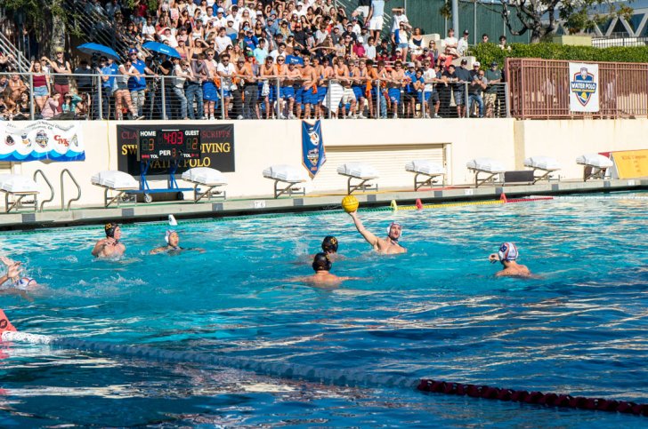 students play a water polo game
