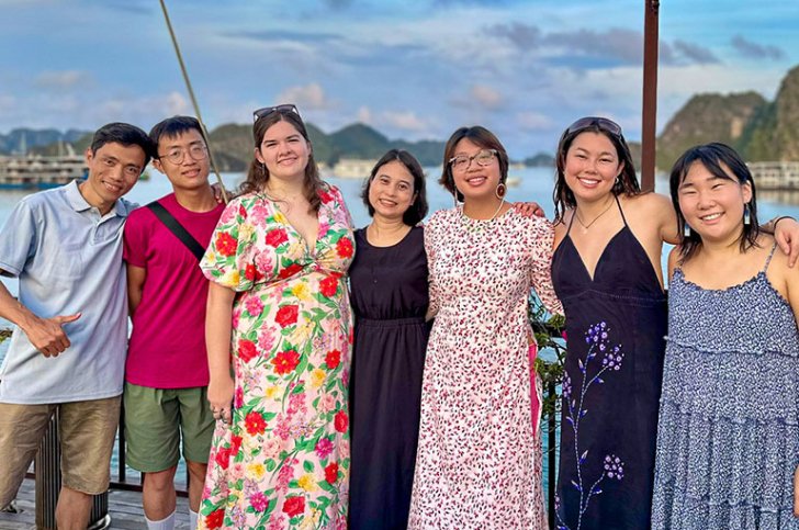 a group of students pose in front of Ha Long Bay