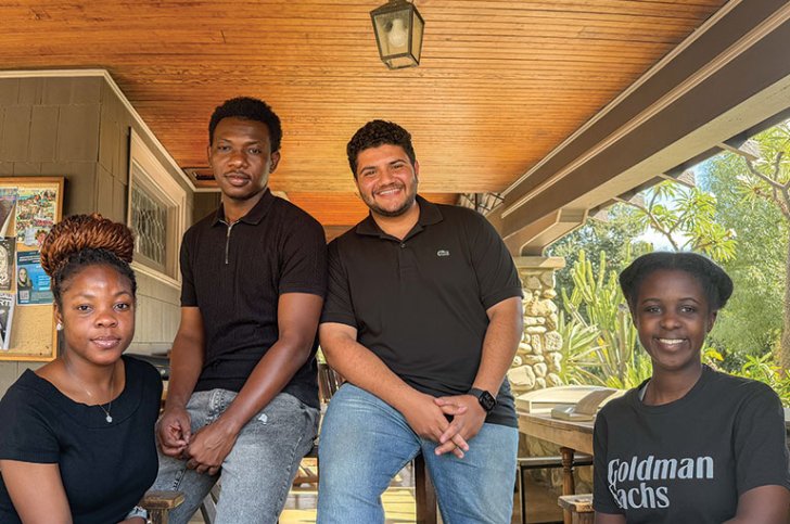 The founds of the Pitzer Connect tech club pose on the porch of the Grove House