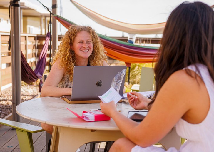 Pitzer students work outside a residence hall