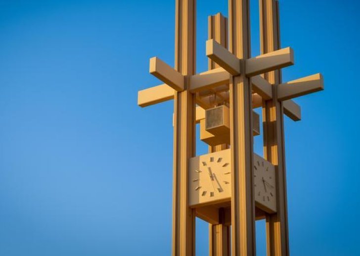 the brandt clock tower against a blue sky