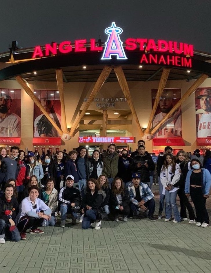 group of students standing in front of Angel stadium