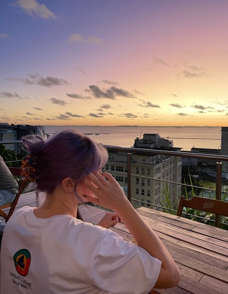 Photo of student looking for the water at sunset in Brazil