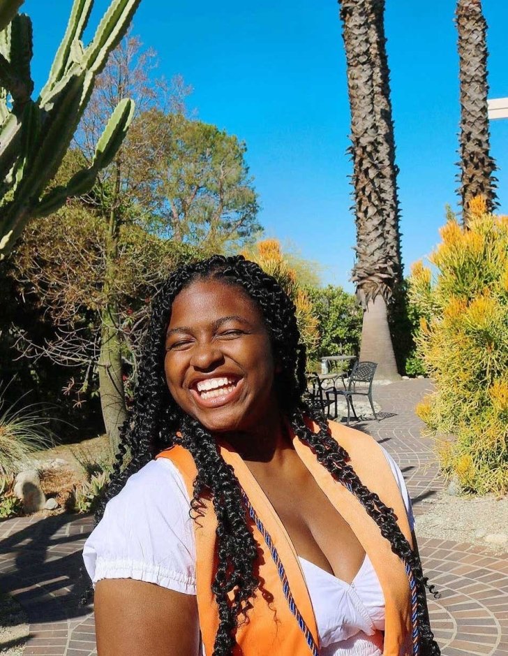 Kaila Teague poses outside of the grove house