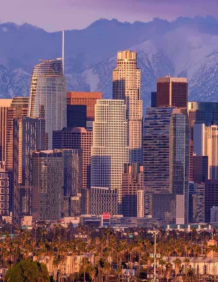 view of downtown los angeles looking north with the san bernardino mountains in the background