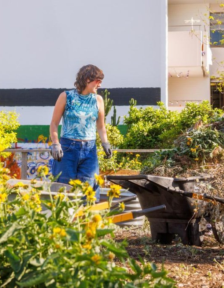 three students work in the Pitzer student garden
