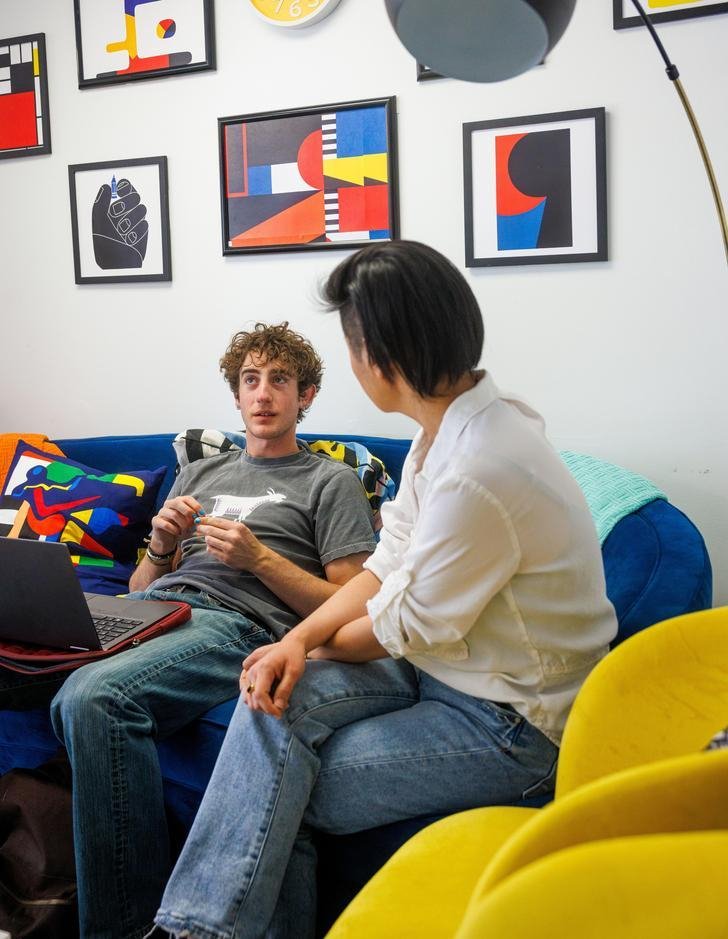 a student talking to a writing center director