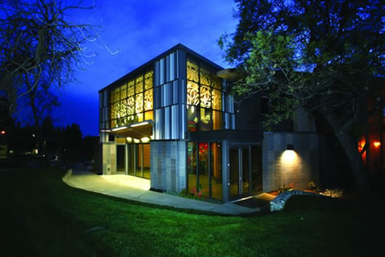 Courier Benson Auditorium at night with lights on in 2010. 