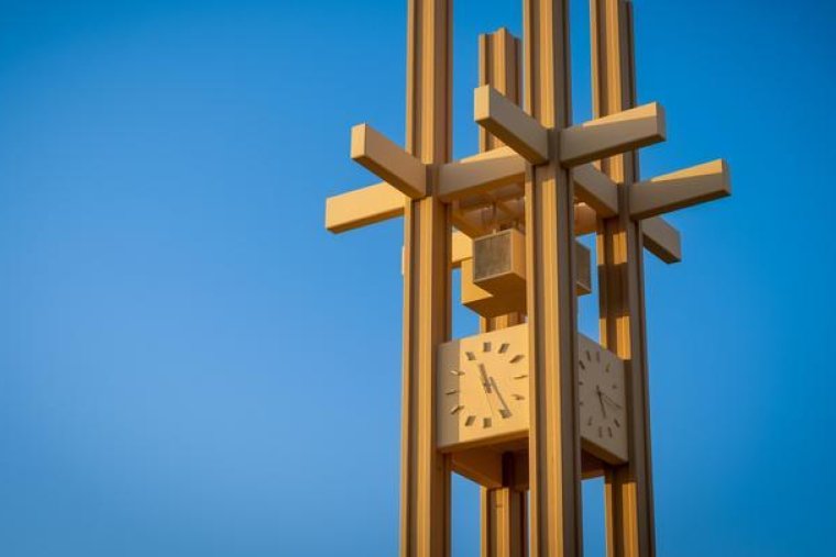 the brandt clock tower against a blue sky