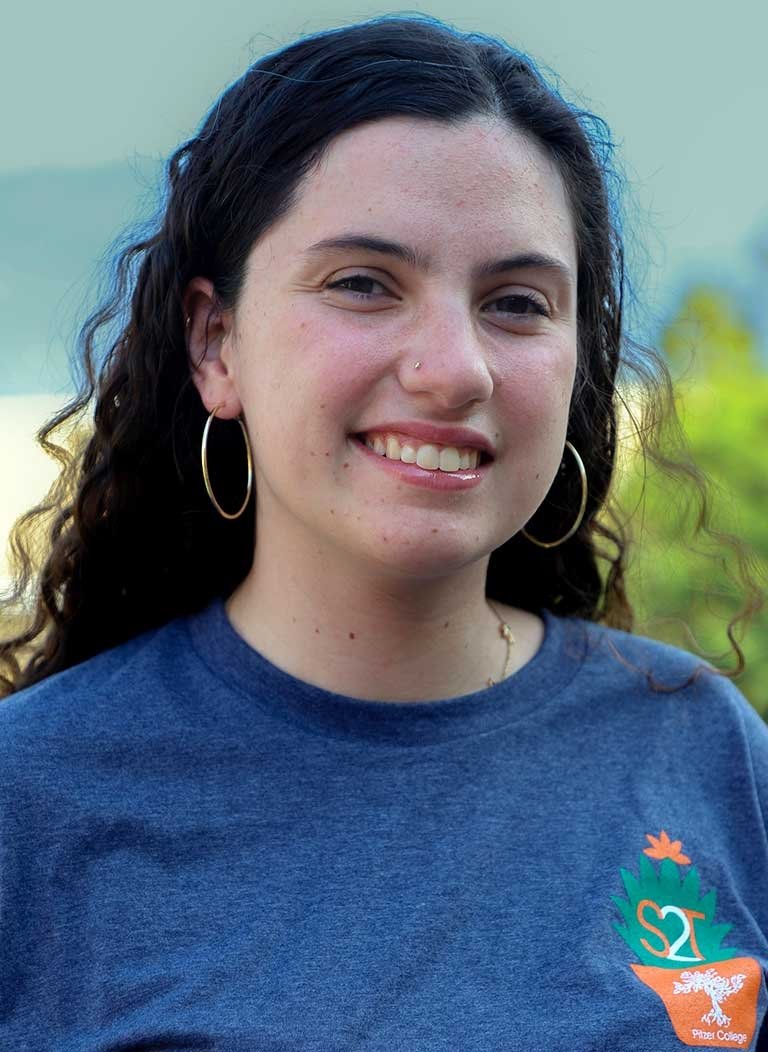 portrait of kaitlyn o'conner wearing a blue strive to thrive shirt