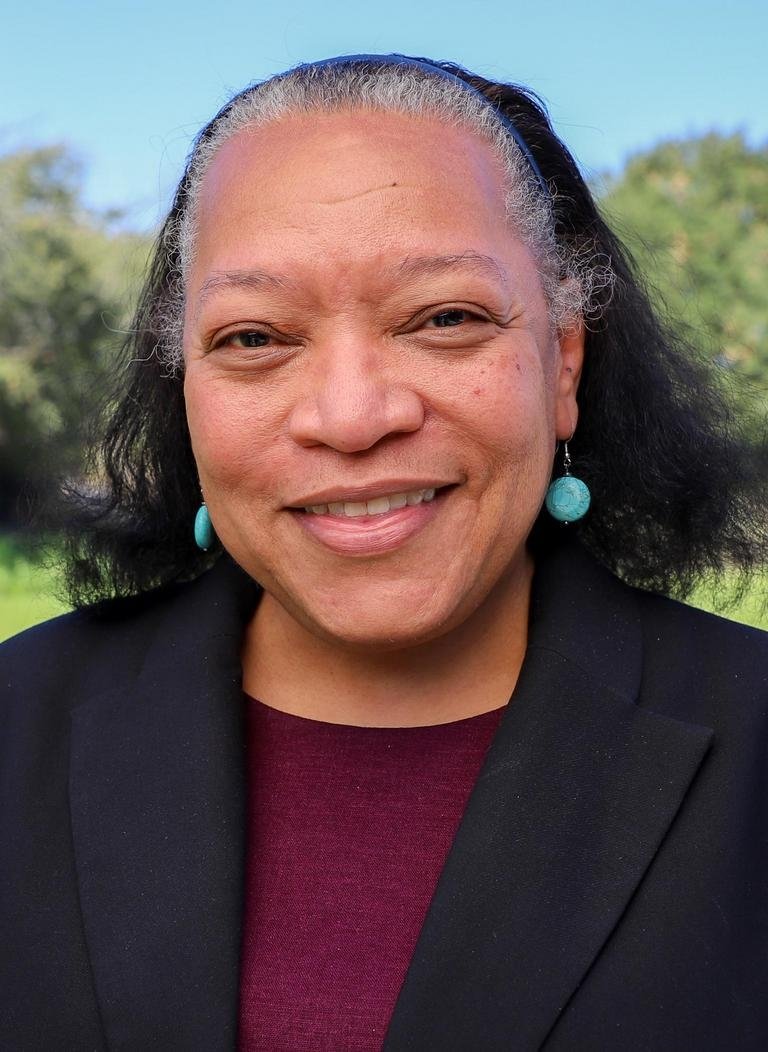 headshot of Chawne Kimber with the Pellessier Field behind her