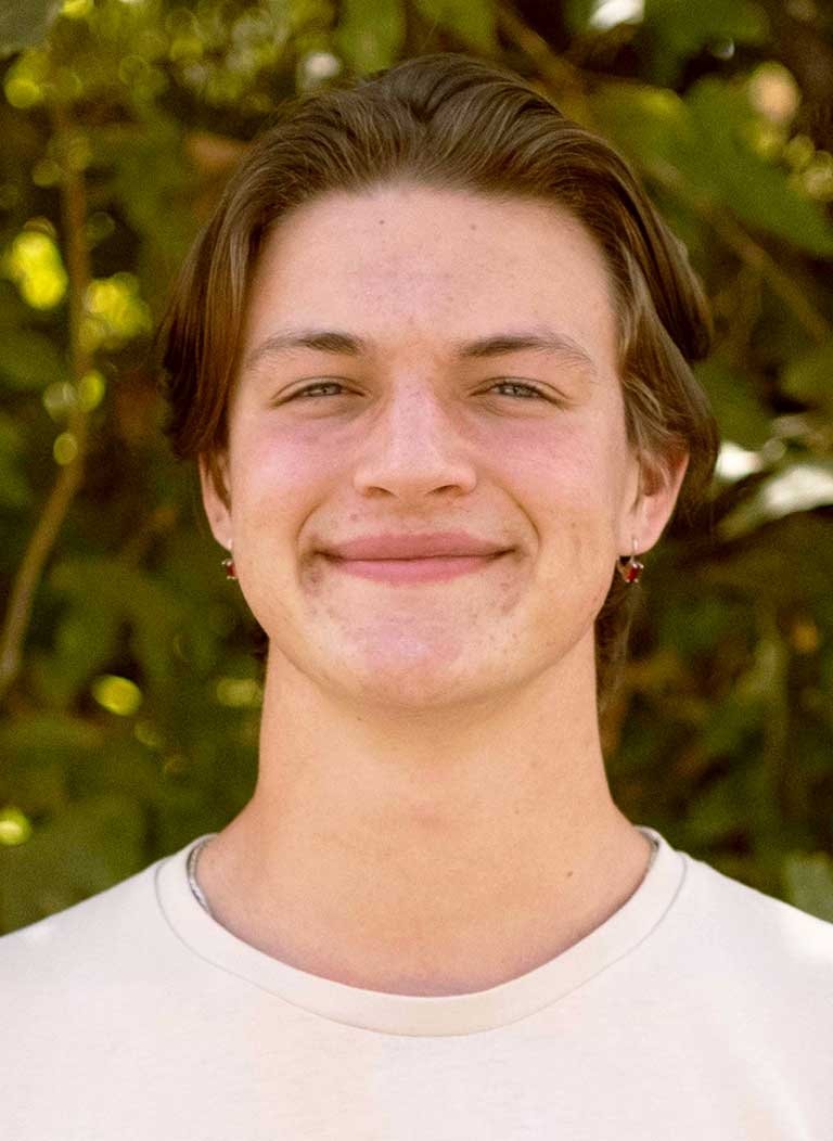 head shot of harold fuson standing in front of outdoor greenery