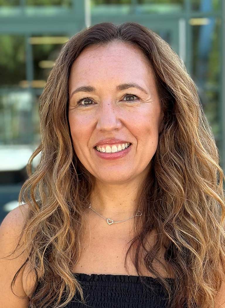 head shot of jaylene shoji standing in front of an office building