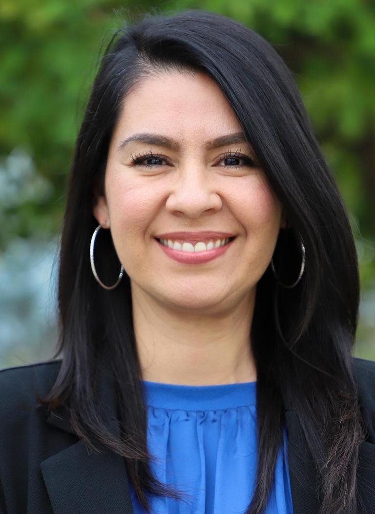 headshot of Cristal Hernandez wearing a blue blouse and black blazer