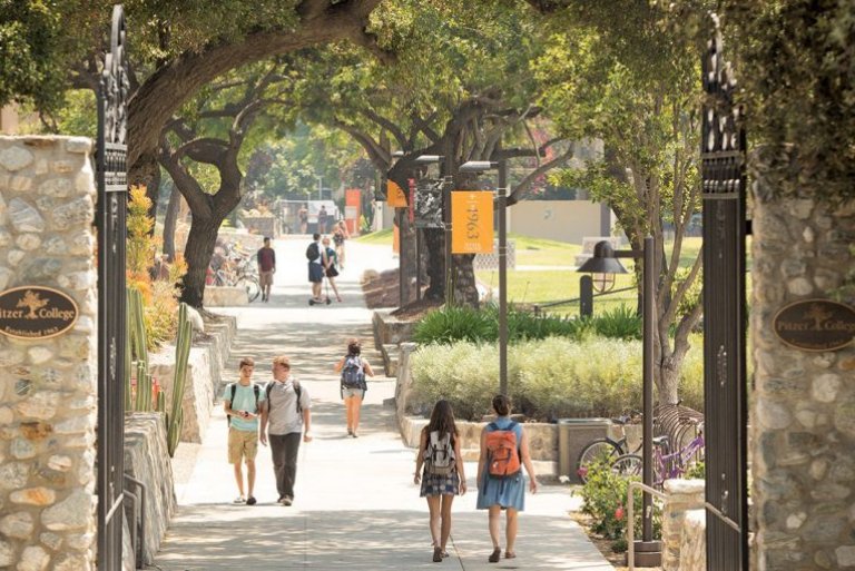 Pitzer College Gates with students walking