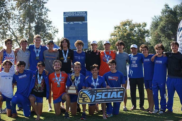the Sagehen Men's Cross Country team poses as a group with the 2025 SCIAC championship banner