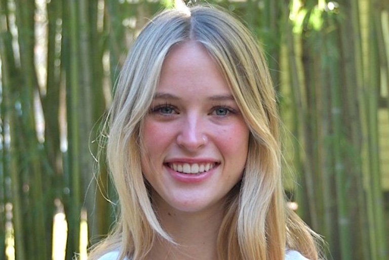 headshot of stella stringer with bamboo in the background