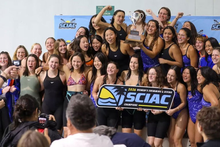 the women's swim team pose with the 2026 SCIAC champions sign
