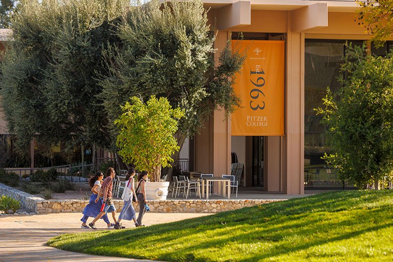 a group of students walk in front of McConnell Center