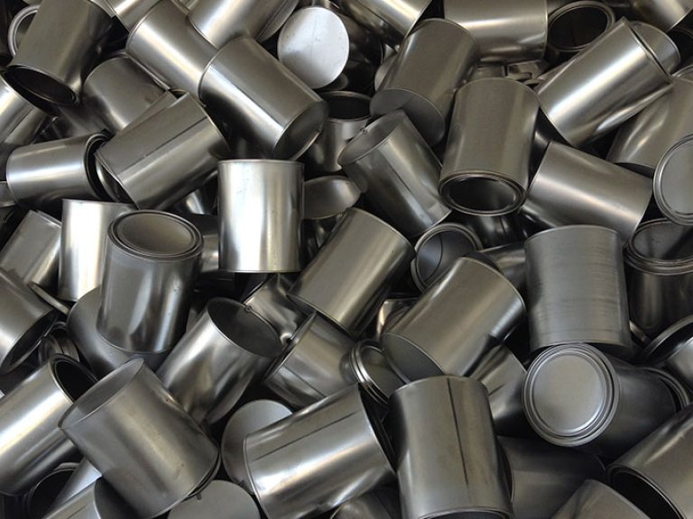 a pile of aluminum food cans