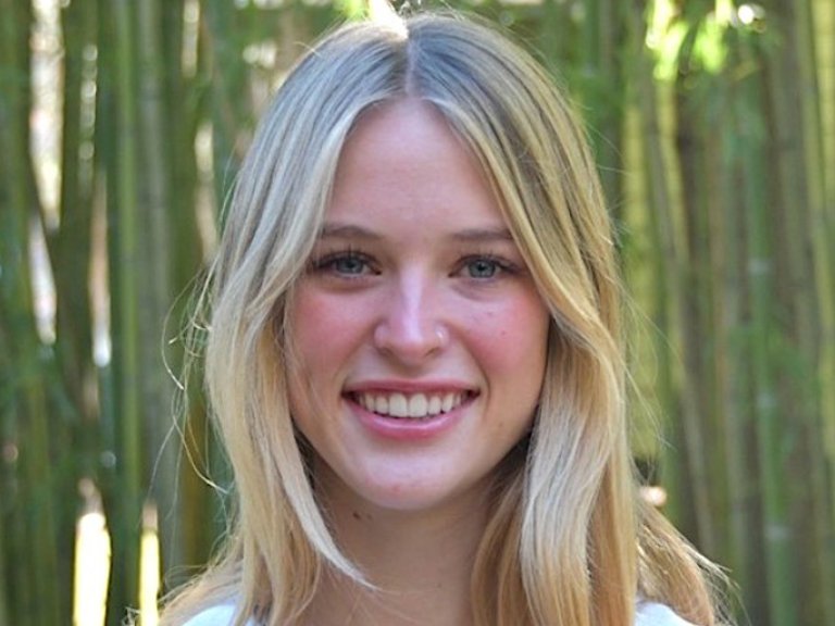 headshot of stella stringer with bamboo in the background
