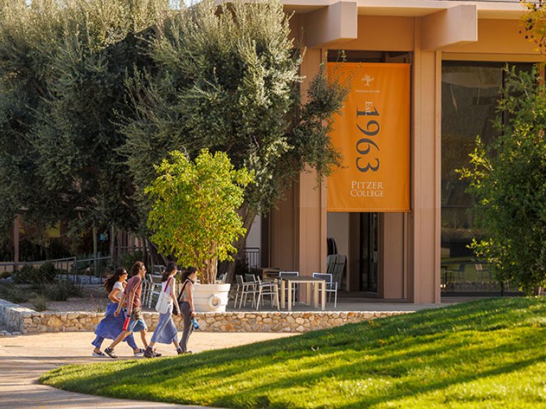 a group of students walk in front of McConnell Center
