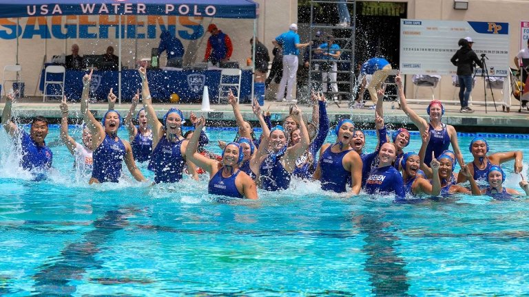 team poses in the pool