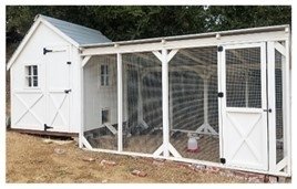 A photo of a white chicken coop