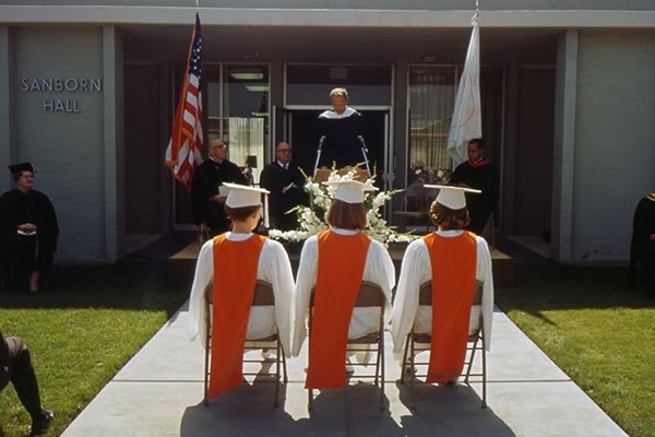 Photo of the first three graduates of Pitzer College in. 1965