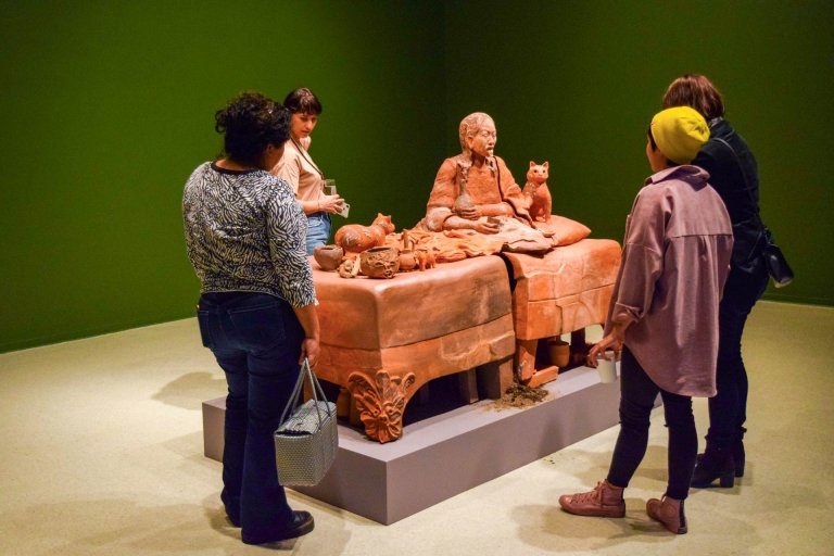 People observe the Candice Lin display at the art gallery