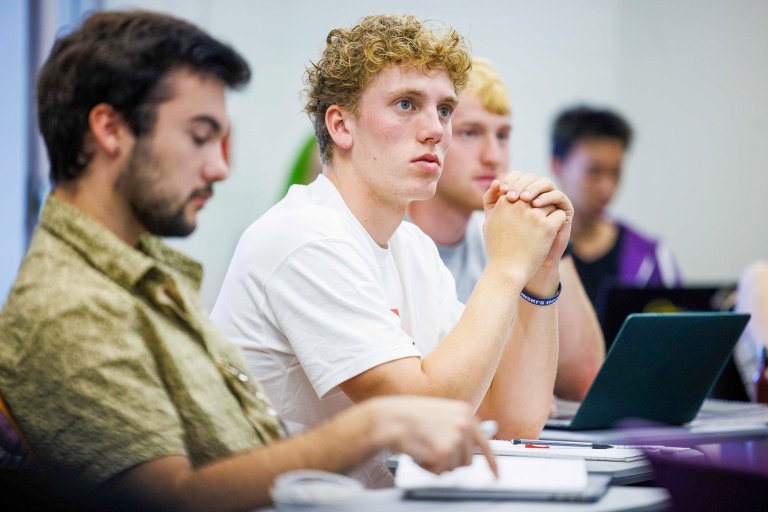 Student attentivley listens in class.