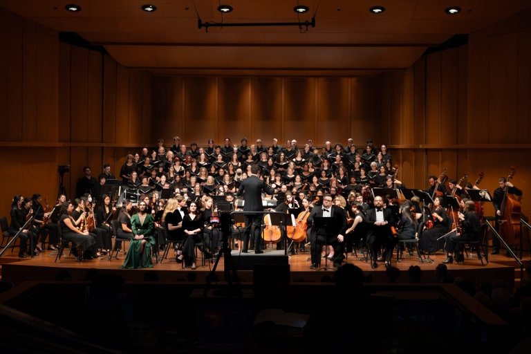 The choirs and orchestra of the Joint Music Program perform in Scripps Garrison Theater.