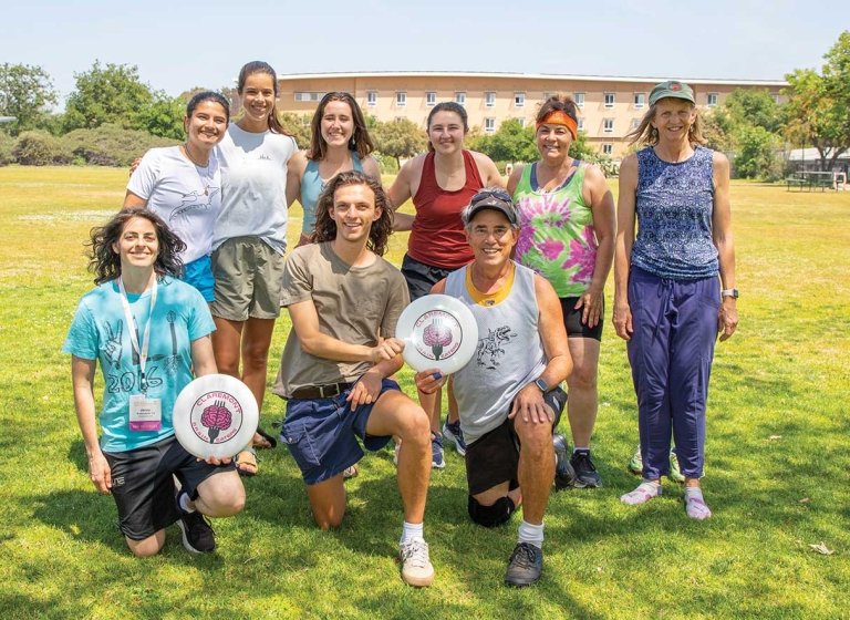 a group of of pitzer ultimate frisbee players pose post-game