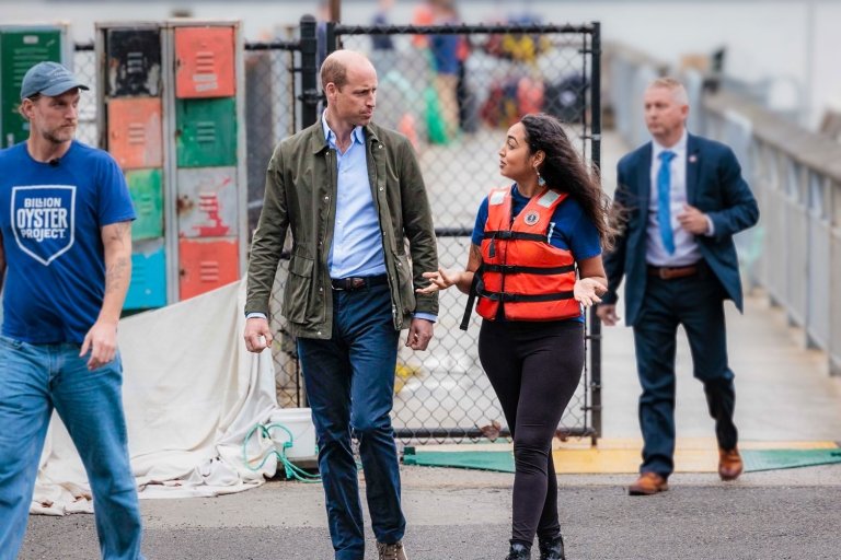 Pitzer alumna Shinara Sunderlal greets Prince William for a tour of New York Harbor