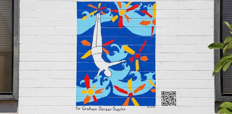 A mural painted in honor of Pitzer alum Graham Derzon-Supplee