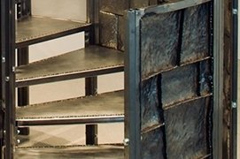 an upclose view of metal spiral staircase stairs