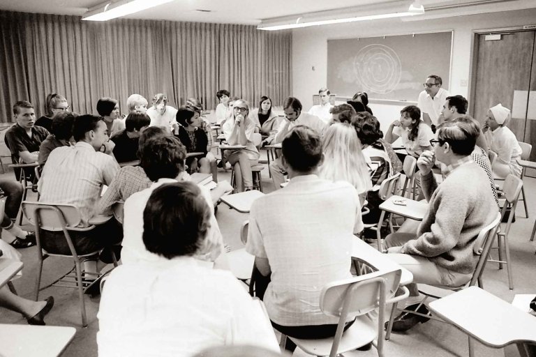 a Pitzer classroom in 1968with students sitting in a circle in chairs