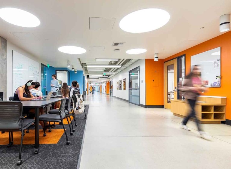 a long corridor features mixed use spaces