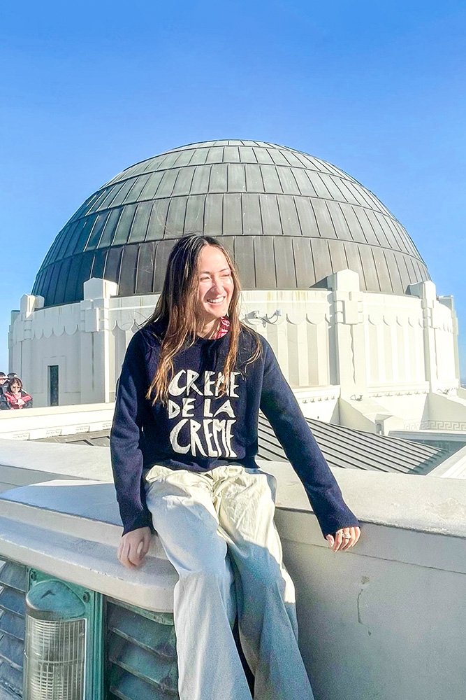 Scotia Rollins sits in front of Griffith Observatory