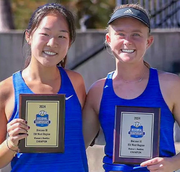 Angie Zhou and Marissa Markey hold up their trophy plaques